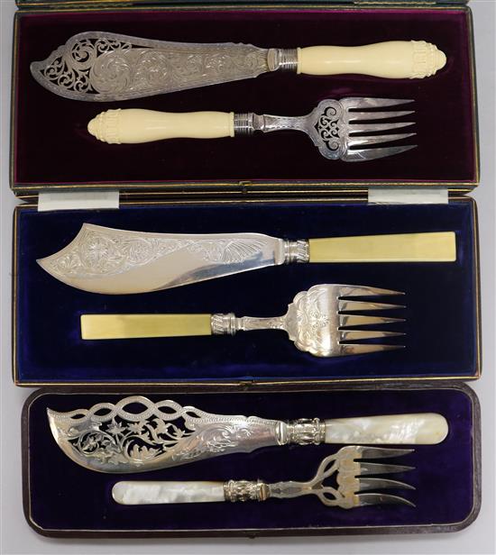 Three cased pairs of plated fish servers; Victorian and later
